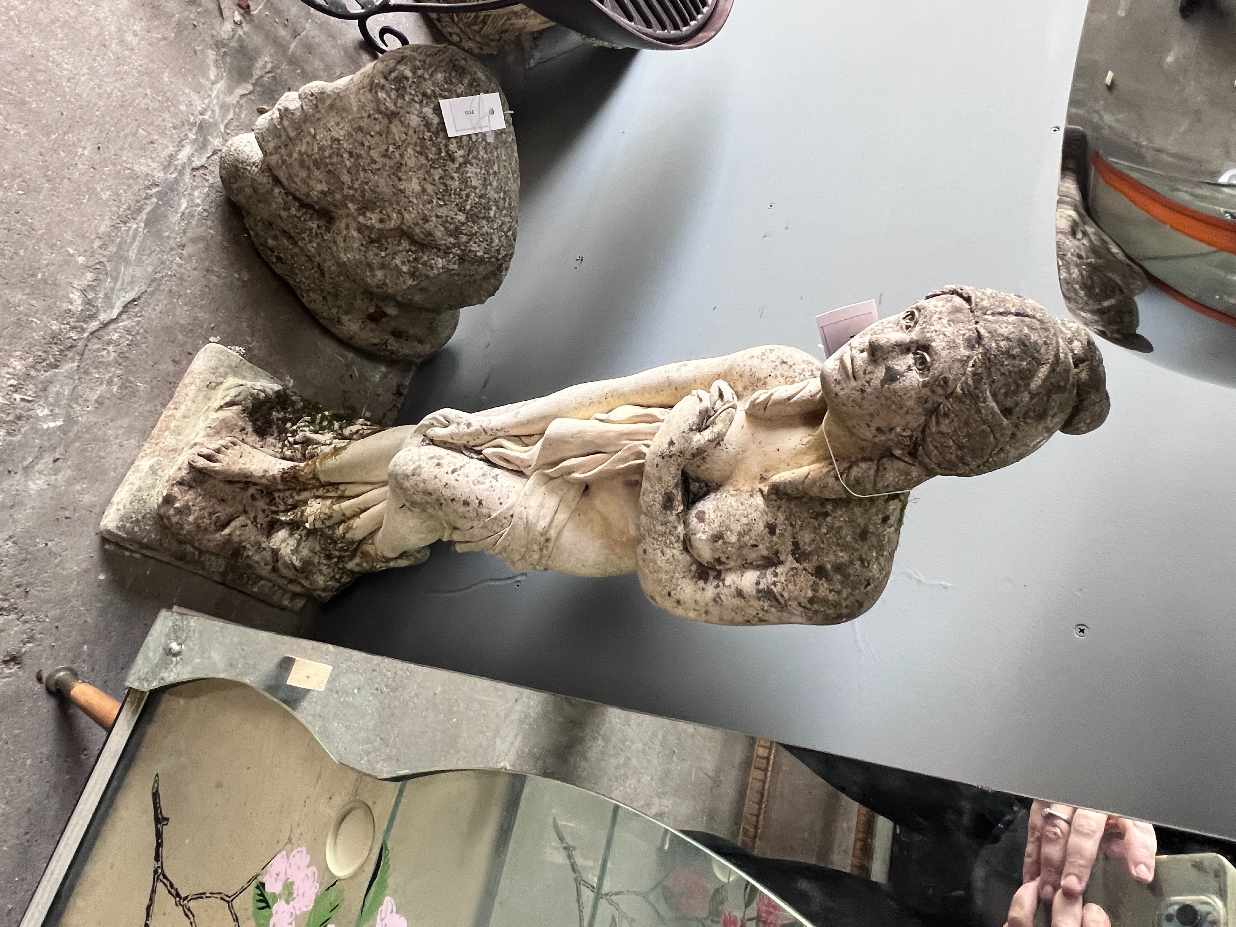 A reconstituted stone garden statue of a female bather, height 95cm